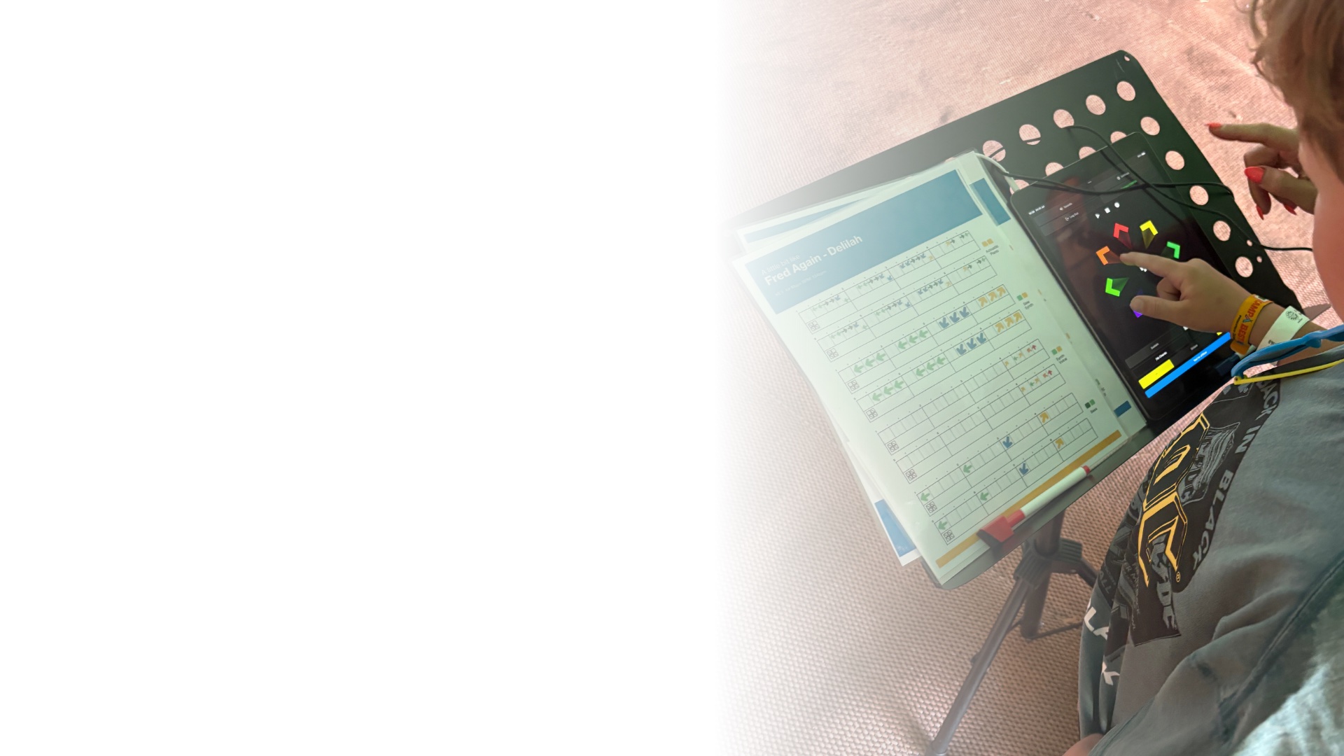 A participant playing Swipe on a tablet at a Digit Music festival session.